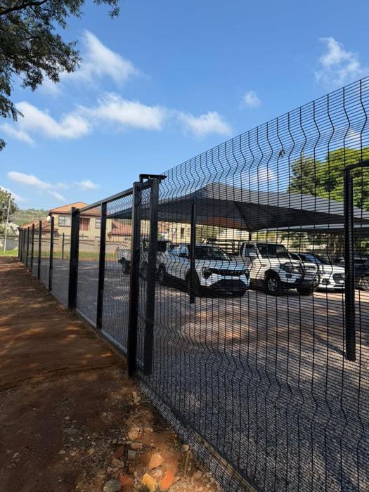 Clearview fence around a covered parking area